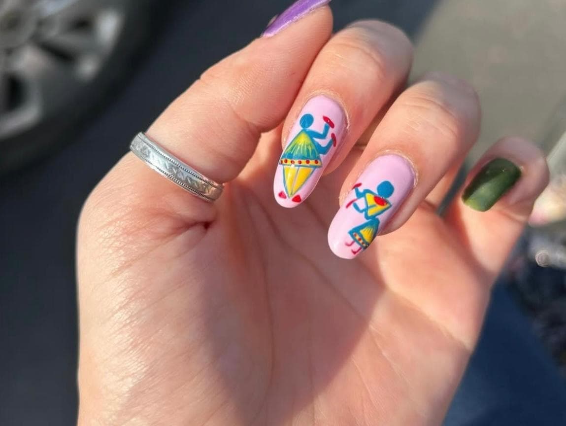 Colourful folk-art inspired nail designs with intricate hand-painted detailing