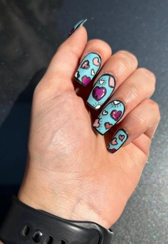 Pop art heart nail design with bold colour blocking and glossy gel finish