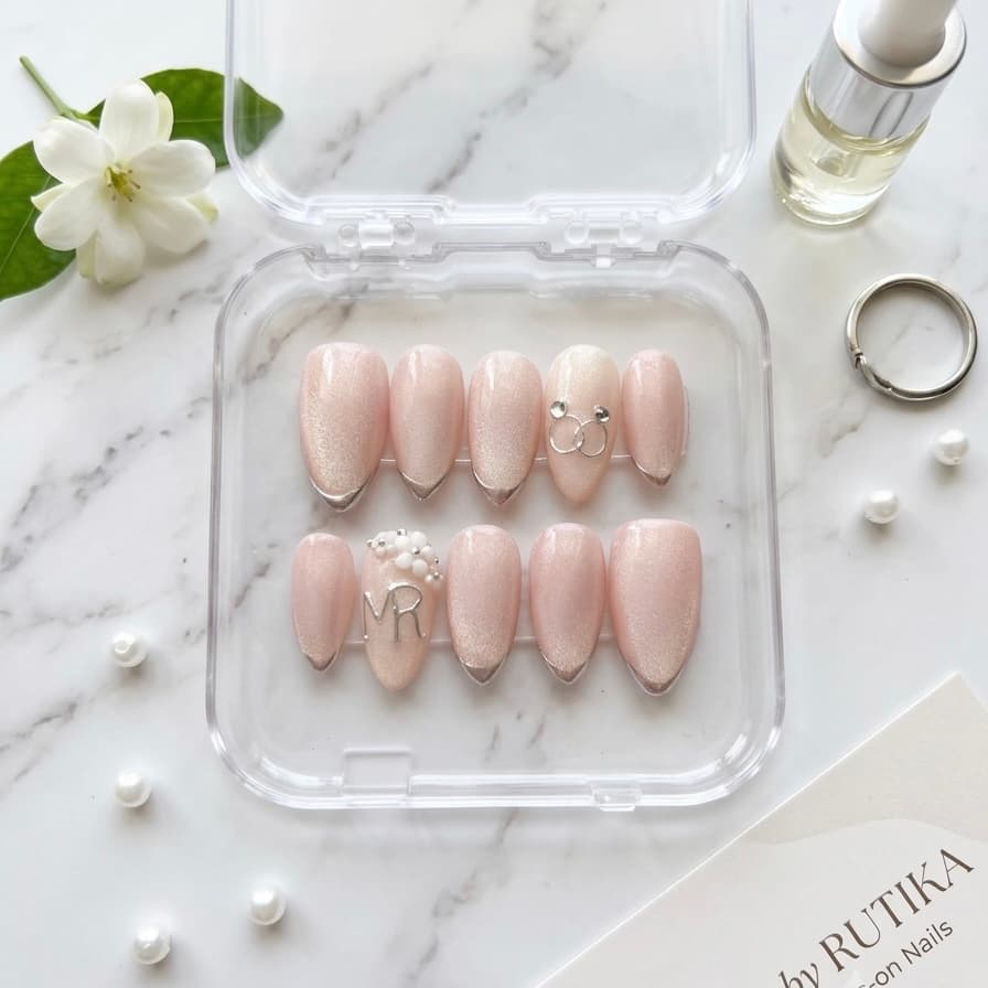Pale pink cat eye press ons with silver French tips and MR monogram